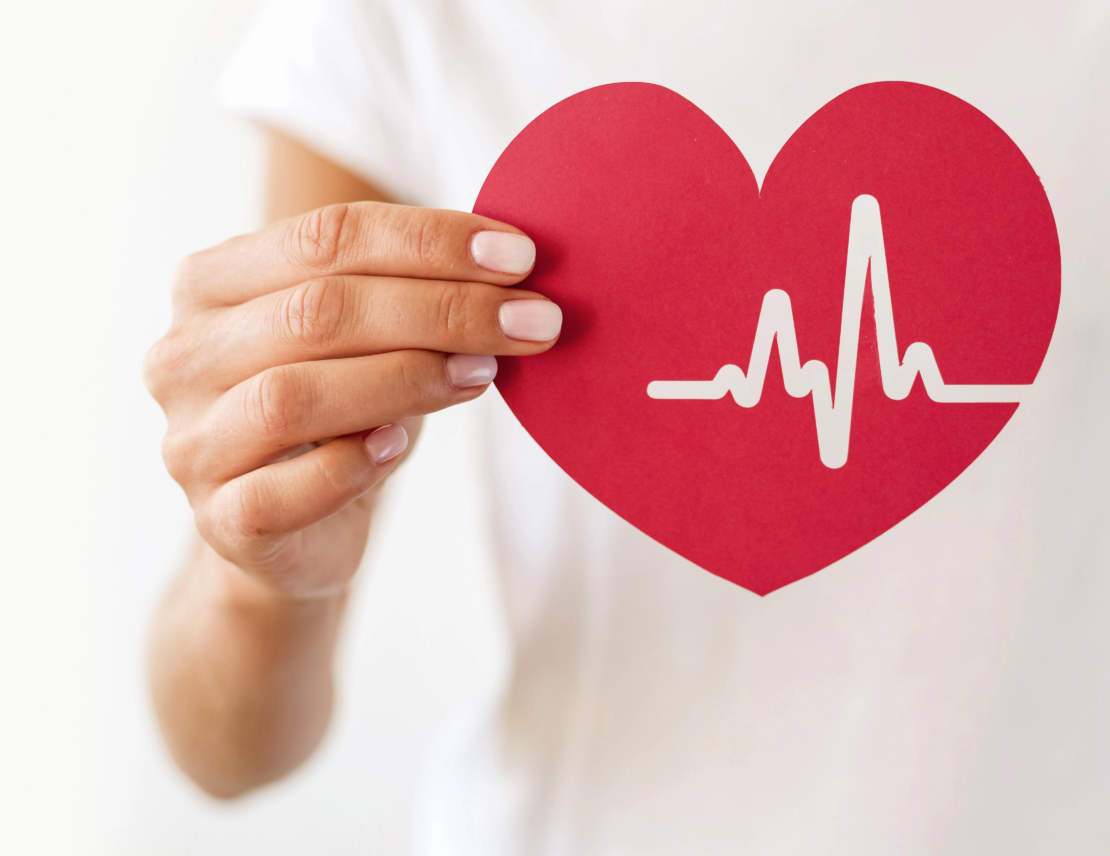 front-view-woman-holding-paper-heart-with-heartbeat